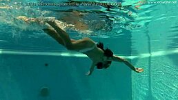 Petite teen irina russaka shows tight pussy and small tits underwater in pool.
