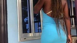 The crazy bitch performs an energetic twerk on the balcony outdoors.