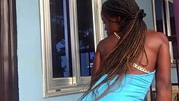 The crazy bitch performs an energetic twerk on the balcony outdoors.