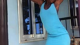 The crazy bitch performs an energetic twerk on the balcony outdoors.