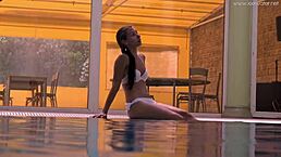 Petite teen irina russaka shows tight pussy and small tits underwater in pool.