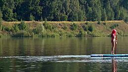 Skinny babe in pink micro bikini flashing outdoors in garden
