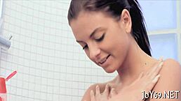 Solo gal stimulates her small tits and tight cunt with dildo.