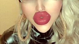 Oiled belly dancer in latex catsuit performs to music for financial domination