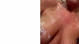 The mature milf with big tits sits on his face on the couch