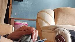 As a young latina amateur, I am masturbating my cock in the living room while sniffing panties