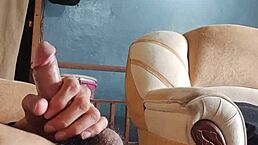 As a young latina amateur, I am masturbating my cock in the living room while sniffing panties