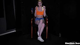 big tittied redhead eagerly sucks huge cocks at gloryhole