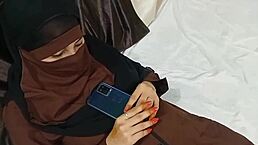 The hot muslim sister-in-law seduced her stepbrother on the bed after lifting her hijab.