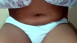 Thai ladyboy shemale flaunts erotic white panties and matching bra.