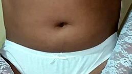 Thai ladyboy shemale flaunts erotic white panties and matching bra.