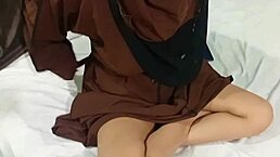 The hot muslim sister-in-law seduced her stepbrother on the bed after lifting her hijab.