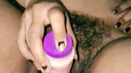 Desi hot Indian girl inserts dildo into hairy pussy while moaning loudly?