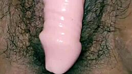 Desi hot Indian girl inserts dildo into hairy pussy while moaning loudly?