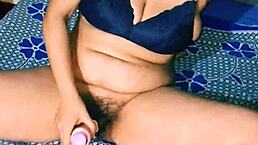 Desi hot Indian girl inserts dildo into hairy pussy while moaning loudly?