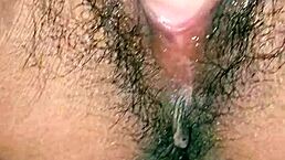 Desi hot Indian girl inserts dildo into hairy pussy while moaning loudly?