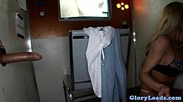 Glamcore babe with big tits sucks cock at gloryhole!