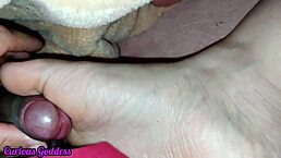 Curious goddess dominates with footjob and feet drenched in cumshot