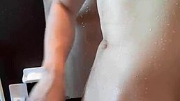 muscular handsome guy in shower time with cute young body