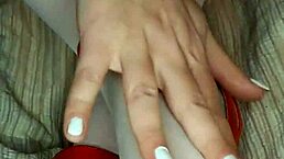 Slowly removing red shoes and white silk stockings for a foot fetish delight