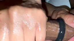 Intense handjob grips massive black cock with horny force on big ass.