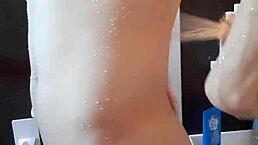 muscular handsome guy in shower time with cute young body