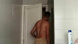 Why is this hot guy drinking while shaving his massive cock?