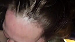 Milf sucks cock while playing with her tits in deep throat.