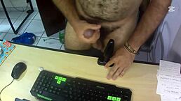 I jerkoff my cock over my desk and cum with my big black plug