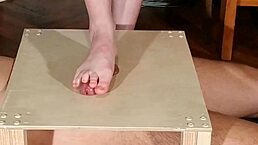 domina uses her bare feet for cock stomping and footjob part 1