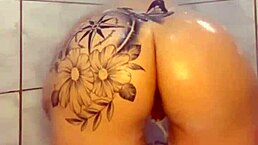 She dances, then plays with her ass in the shower.