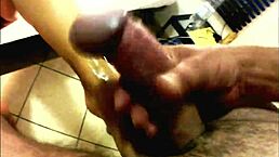 Why endure ball busting pain in bondage? Watch this femdom amateur kick balls and give handjob with cum on feet.