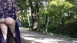 hairy mature woman flashes her pussy under skirt in public park!