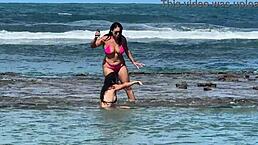 two brazilian girls kiss and play with big asses on the beach