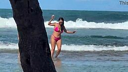 two brazilian girls kiss and play with big asses on the beach