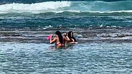 two brazilian girls kiss and play with big asses on the beach