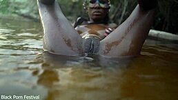 Bold Skinny Dark-Skinned African Hottie Teases With Her Tits In The Water