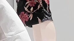 Skinny young brunette in sexy one piece swimsuit shows off legs and small waist