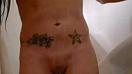 emy angel enjoys a relaxing shower, touching her petite body.