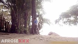 Black girl teases playfully on the beach with fun moves!