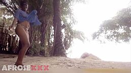 Black girl teases playfully on the beach with fun moves!