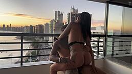 Latina in lingerie bent over for doggystyle anal with tattooed ebony babe riding cowgirl