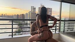 Latina in lingerie bent over for doggystyle anal with tattooed ebony babe riding cowgirl