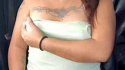 Showing off lingerie and natural tits in car on highway