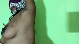 Indian mature woman stands naked to show her hairy pussy lips with big tits and muscular body. She spreads anus and vagina in close-up view.