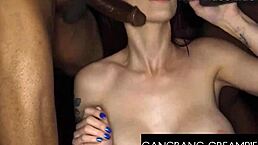 In this intense gangbang scene, a hot redhead babe with big tits gets banged hard by the group. She takes deepthroat blowjobs, doggystyle riding, and ends up with a sloppy creampie sideways.