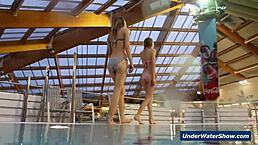 horny girls strip each other in the pool