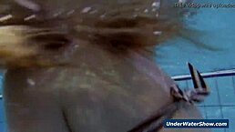 horny girls strip each other in the pool