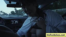 Sexy asian hottie plays with big natural tits in car while friend watches 😏
