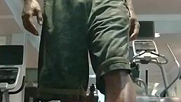 21-year-old athletic black woman with brown eyes works out in gym dorm